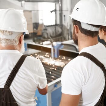 Contact us 5 engineers observing plasma laser cutting metal 1 1 scaled